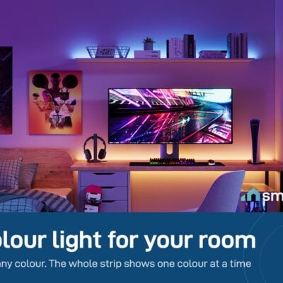 Govee RGB LED Strip Light glowing purple around a desk and shelves