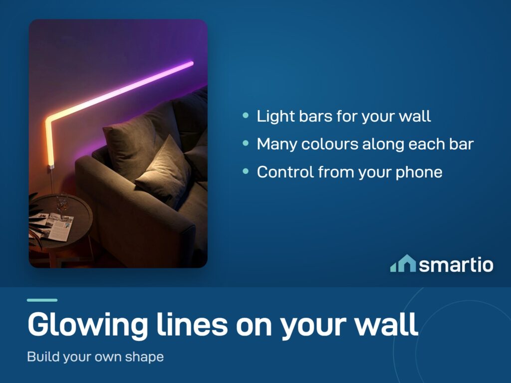 Govee Glide Wall Light bars glowing pink and orange on a wall above a sofa