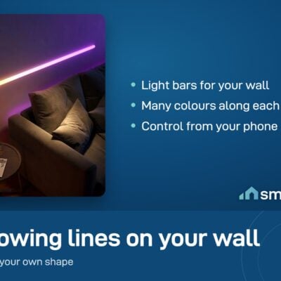 Govee Glide Wall Light bars glowing pink and orange on a wall above a sofa