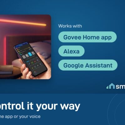 Govee Glide Wall Light glowing above a bed with the Govee Home app on a phone; works with Alexa and Google Assistant