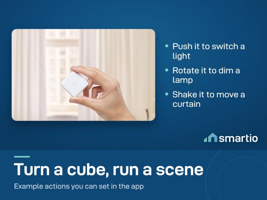 A hand holding the Aqara Cube in front of a window with curtains