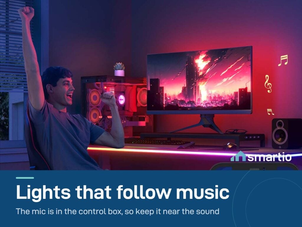 Person cheering at a gaming desk with the Govee neon rope light following the music