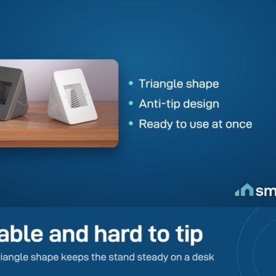 Two Sonoff desk stands for the NSPanel, one dark grey and one white, on a wooden desk