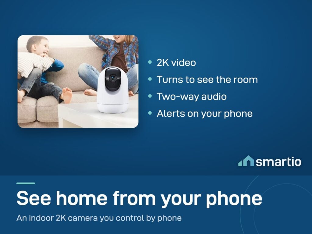 CloudEdge Pan and Tilt Camera on a table in a living room with two children playing on the sofa