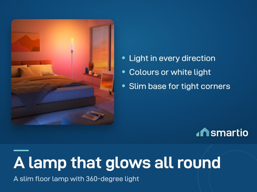 Govee Cylinder Floor Lamp glowing beside a bed in an orange bedroom