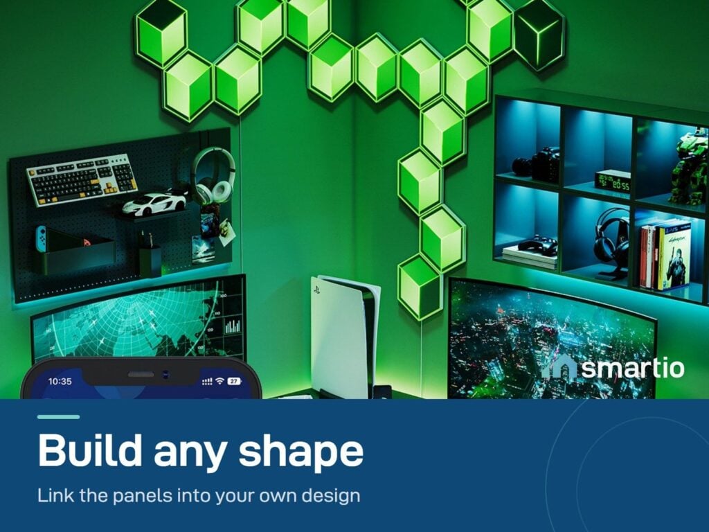 Green Govee Glide Hexagon panels arranged in a custom shape on the wall of a gaming room