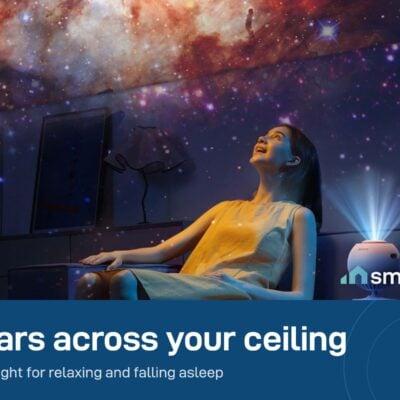 POCOCO Galaxy Star Projector lighting a room with a galaxy on the ceiling while a woman relaxes