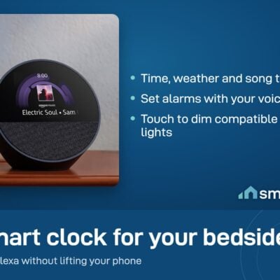 Amazon Echo Spot smart alarm clock on a shelf, its screen showing a song title
