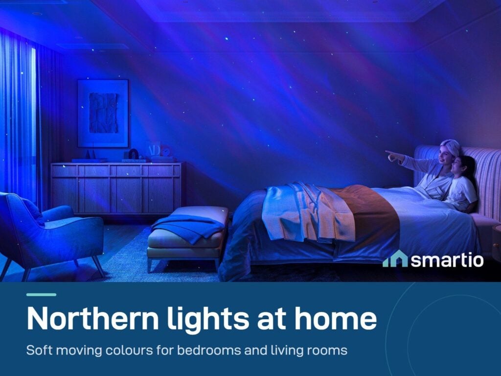 Govee Star Light Projector filling a bedroom wall and ceiling with blue and purple aurora colours