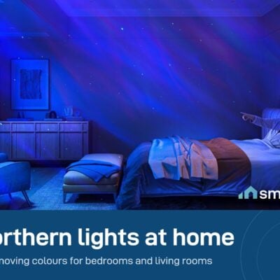 Govee Star Light Projector filling a bedroom wall and ceiling with blue and purple aurora colours