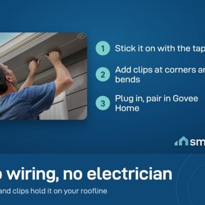 A man fixing a Govee Permanent Outdoor Light under a roof edge with tape and clips; no wiring needed
