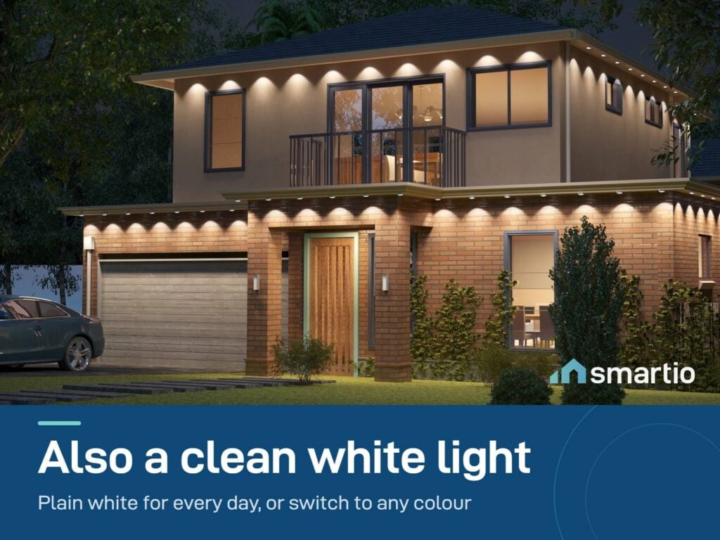 Govee Permanent Outdoor Lights 2 in white along the eaves of a two-storey house at night
