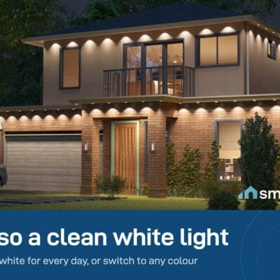 Govee Permanent Outdoor Lights 2 in white along the eaves of a two-storey house at night
