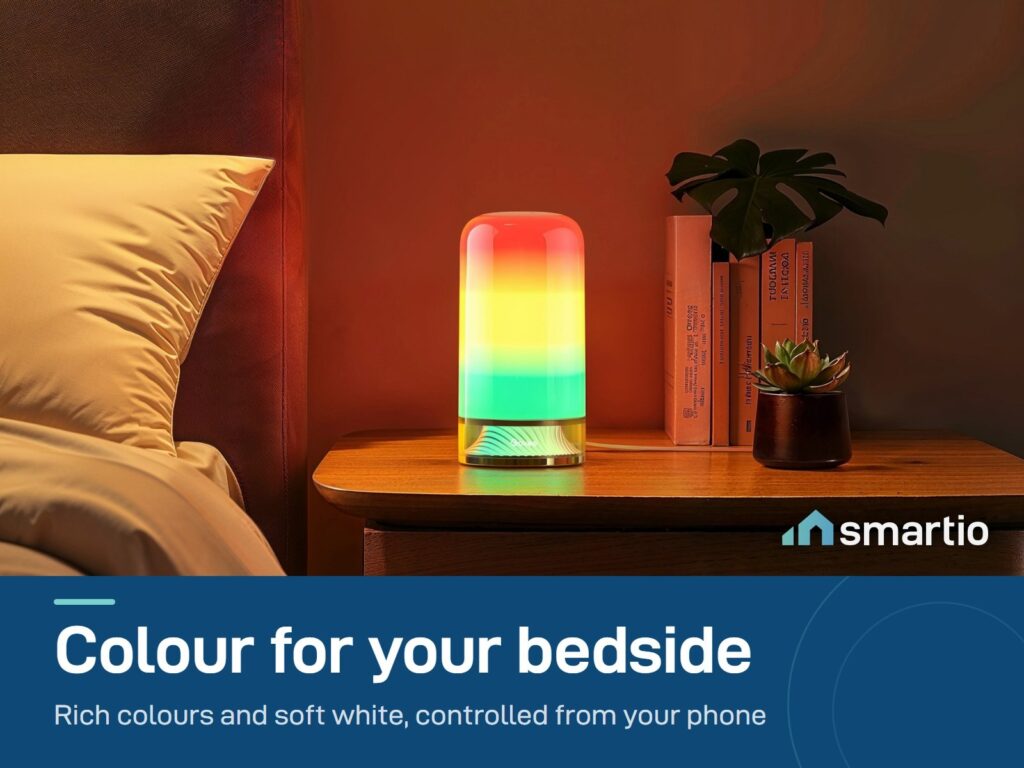 Govee RGBIC Table Lamp 2 glowing in rainbow colours on a bedside table
