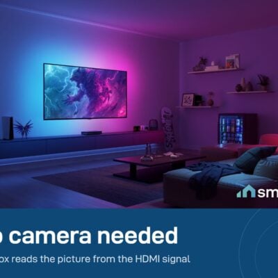 Govee Sync Box 2 (55-65 inch) lighting a living room wall in pink and blue with no camera in front of the TV