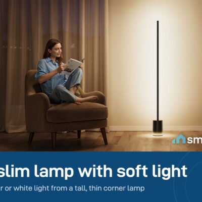 Govee Floor Lamp 2 giving warm light beside a woman reading in an armchair