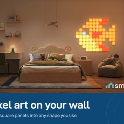 Govee Mini Panel Lights forming a glowing fish shape on a bedroom wall above a bed