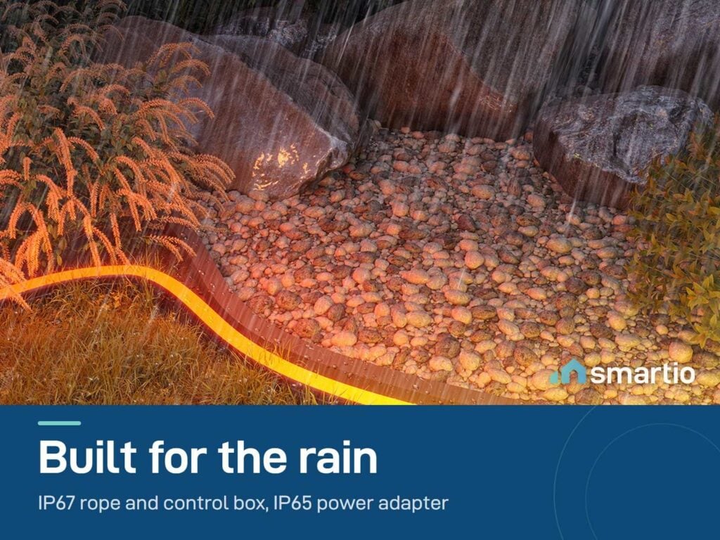 Govee outdoor neon rope light glowing along a garden path in heavy rain