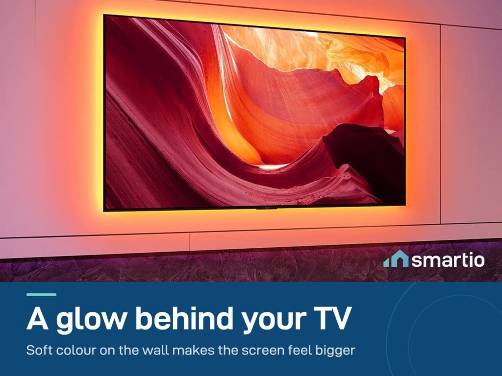 Govee Bluetooth TV backlight lighting the wall behind a TV in a dark room