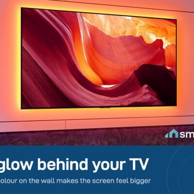Govee Bluetooth TV backlight lighting the wall behind a TV in a dark room