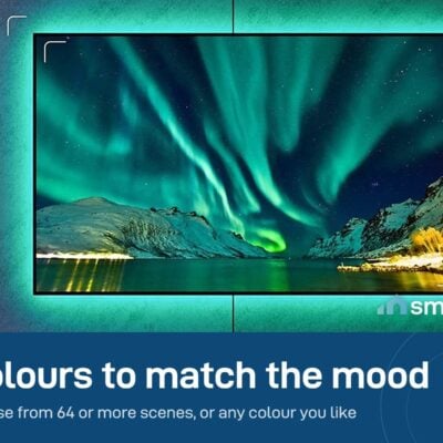 TV with the Govee Bluetooth backlight glowing orange on the wall behind it