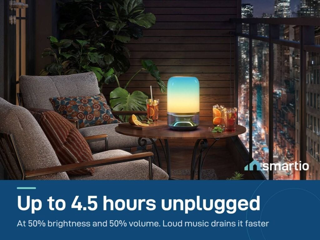 Govee Table Lamp 2 Pro x Sound by JBL glowing on a balcony table at night, running on its 5200 mAh battery