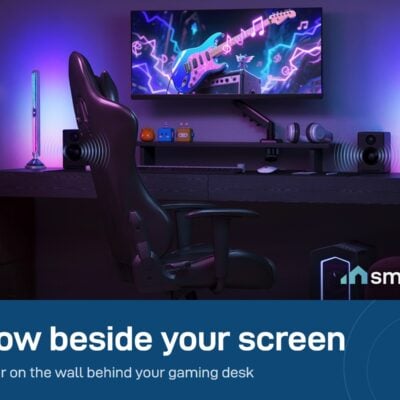 Govee Gaming Light Bars Pro standing on both sides of a monitor and lighting a gaming room in purple and blue