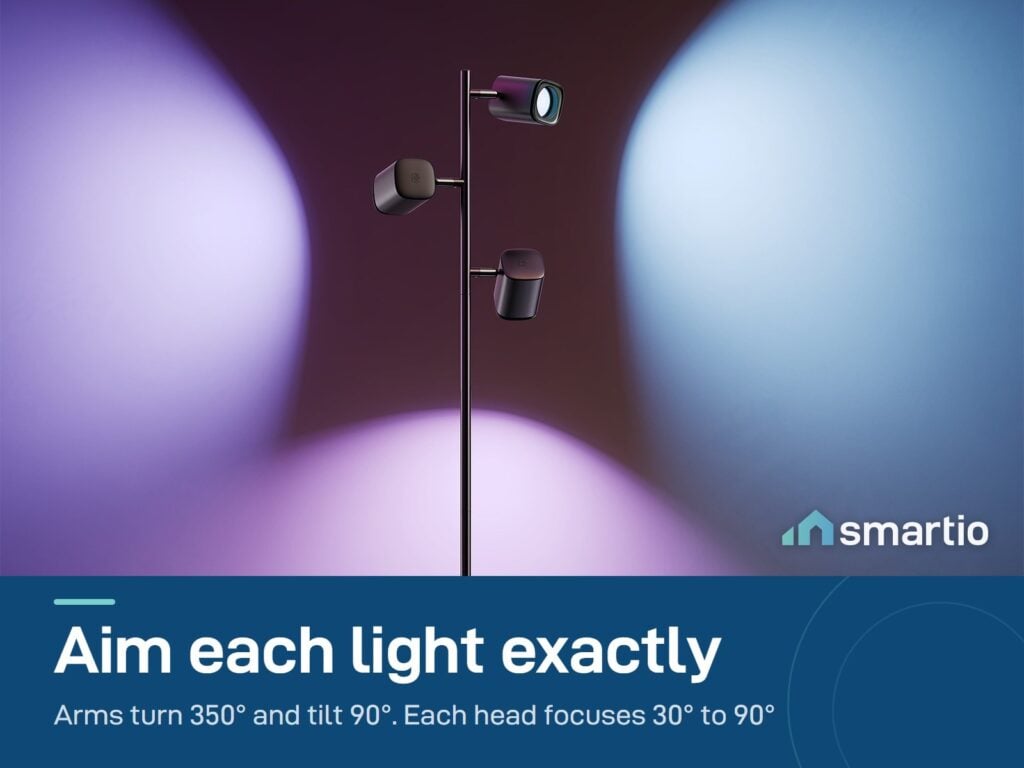 Govee Tree Floor Lamp with three heads aimed in different directions, casting purple, blue and pink beams on the wall