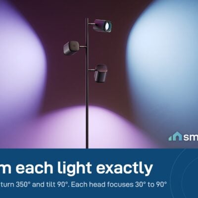 Govee Tree Floor Lamp with three heads aimed in different directions, casting purple, blue and pink beams on the wall