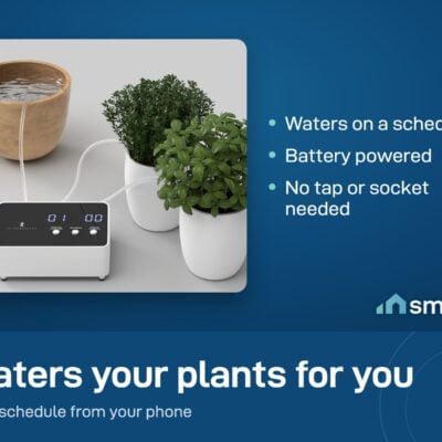 ThirdReality Smart Watering Kit on a shelf beside potted plants, with tubes running to each pot