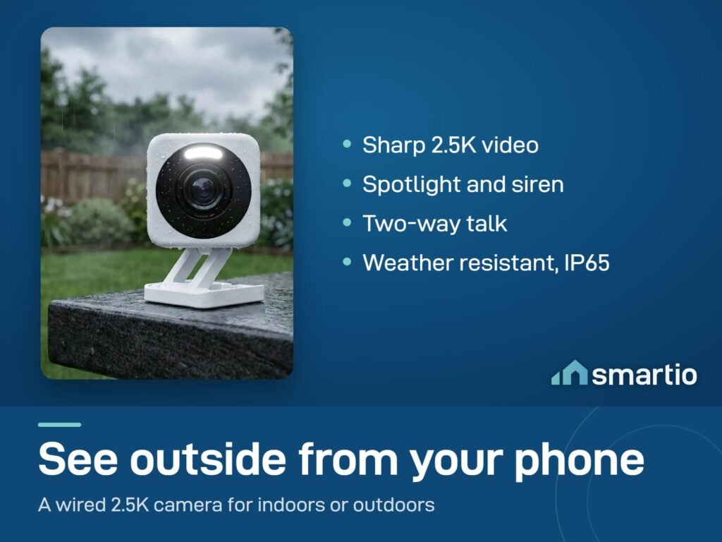 Wyze Cam v4 on an outdoor ledge in the rain, with its spotlight and lens visible