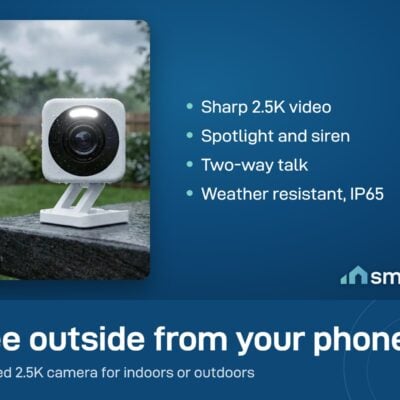 Wyze Cam v4 on an outdoor ledge in the rain, with its spotlight and lens visible
