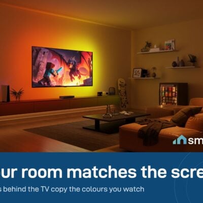 Govee Sync Box 2 (75-85 inch) lighting the wall behind a TV in warm colours that match a game scene