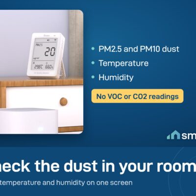 Sonoff AirGuard PM2.5 and PM10 monitor on a bedside table, showing dust, temperature and humidity. It does not measure VOC