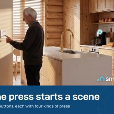 Man pressing a Sonoff Orb 4-button scene remote on a kitchen wall. It needs a Zigbee hub or a Sonoff remote gateway